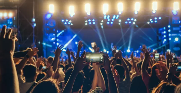 concert-crowd-of-music-fanclub-hand-using-cellphone-taking-video-record-or-live-stream