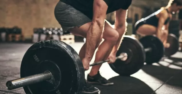strong man doing deadlift training in gym 2022